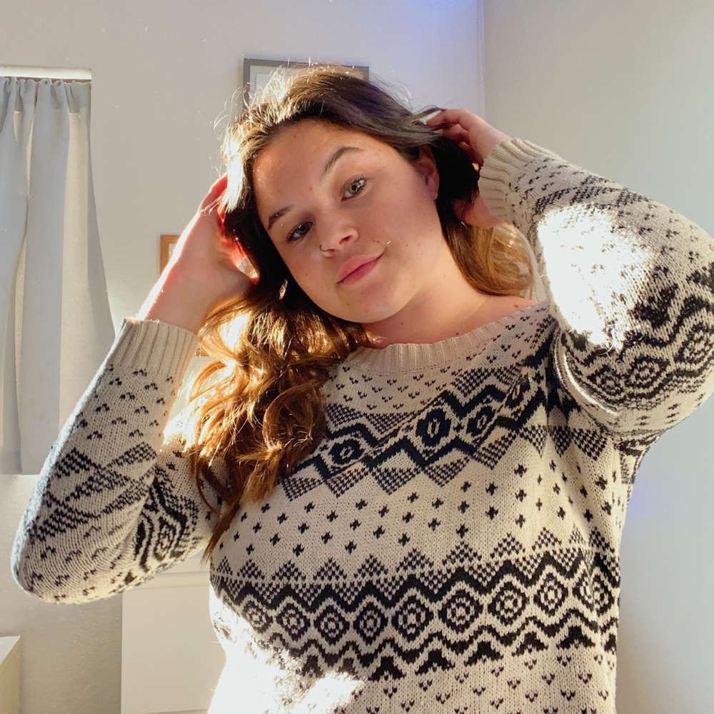 cream and black designed sweater